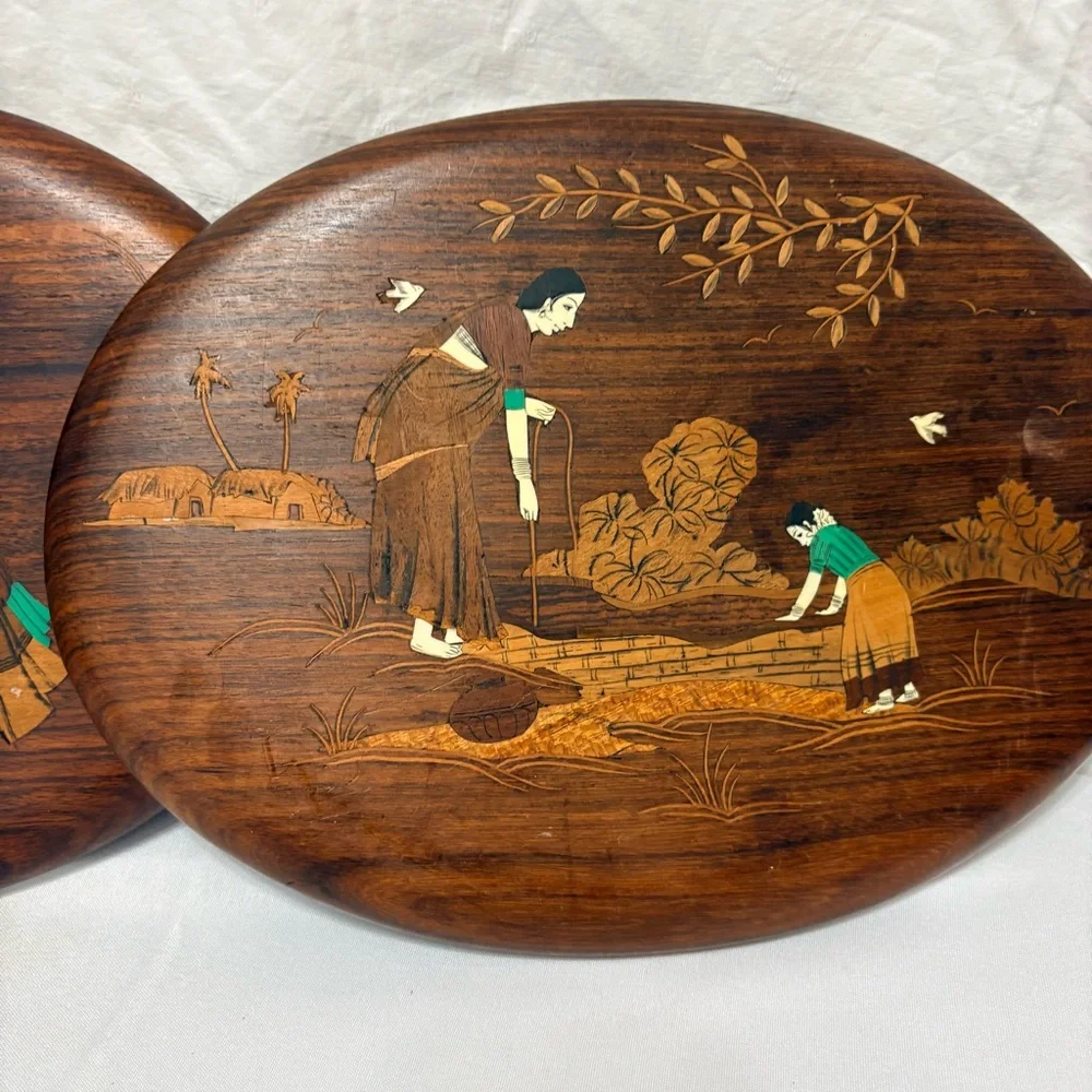 Vintage Indian rosewood wall art plaques with intricate bone inlay designs.